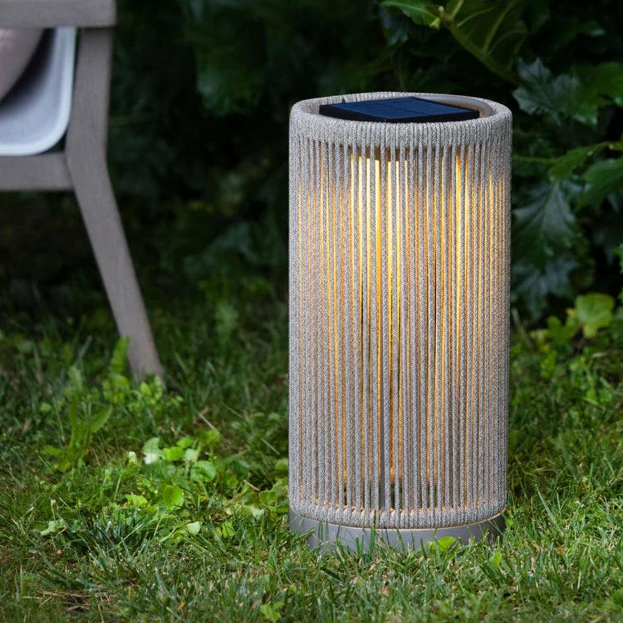 Solar-powered outdoor lamp on grass with a blurred background by Les Jardins available at Spacio retail stores in India.