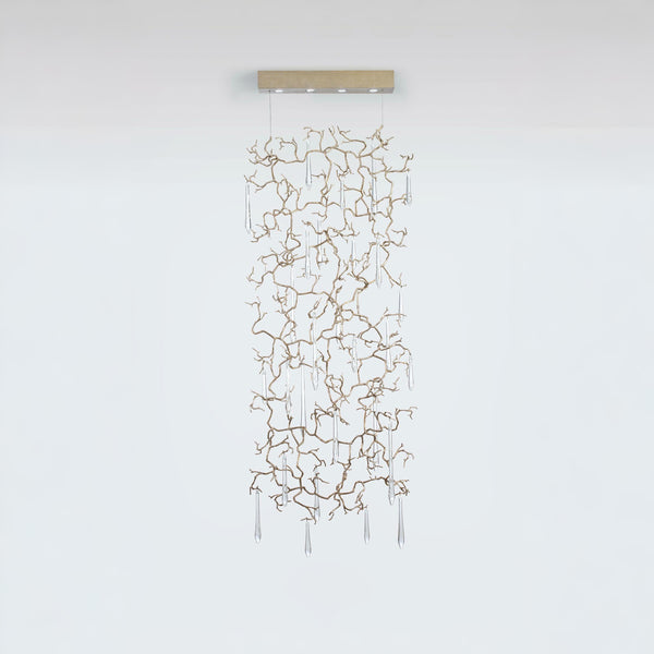 A light screen curtain suspending from the ceiling with clear water drop shaped glass hanging on golden colour branches