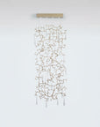 A light screen curtain suspending from the ceiling with clear water drop shaped glass hanging on golden colour branches