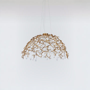 A dome shaped chandelier hanging on wires with water drops shaped glass suspended from branches in gold colour
