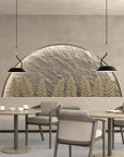 A room with 2 tables and chairs with backdrop of a stone wall with trees and pendant lamps hanging from ceiling. 