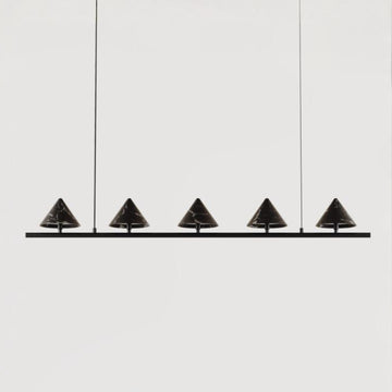 Modern pendant light fixture with five black conical shades on a white background from Aromas Del Campo, available at Spacio retail stores in Mumbai & Kolkata. 
