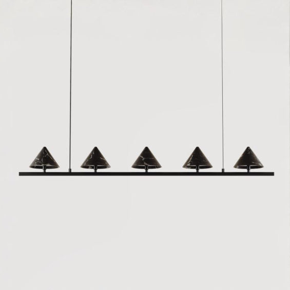Modern pendant light fixture with five black conical shades on a white background from Aromas Del Campo, available at Spacio retail stores in Mumbai & Kolkata. 