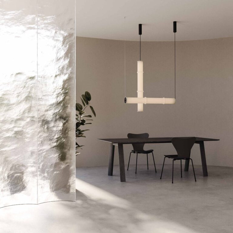 A pair of modern glass suspension lamp hanging from the ceiling in a contemporary theme interiors. 