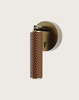 A Wall bedside lamp in leather and brass details from Aromas Del Campo available at Spacio retail stores in Mumbai and Kolkata. 