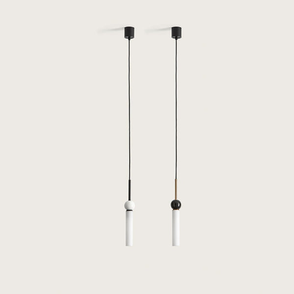 2 pendant lights in glass, marble and metal suspended from a ceiling from Aromas del Campo available at Spacio retail store in Mumbai & Kolkata. 