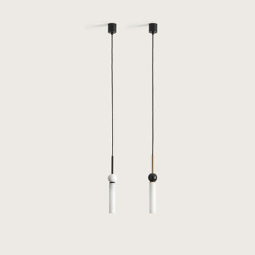 2 pendant lights in glass, marble and metal suspended from a ceiling from Aromas del Campo available at Spacio retail store in Mumbai & Kolkata. 
