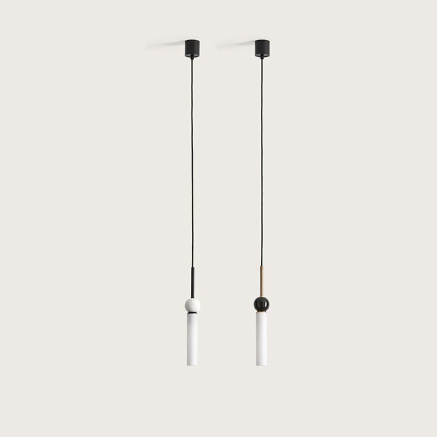 2 pendant lights in glass, marble and metal suspended from a ceiling from Aromas del Campo available at Spacio retail store in Mumbai & Kolkata. 