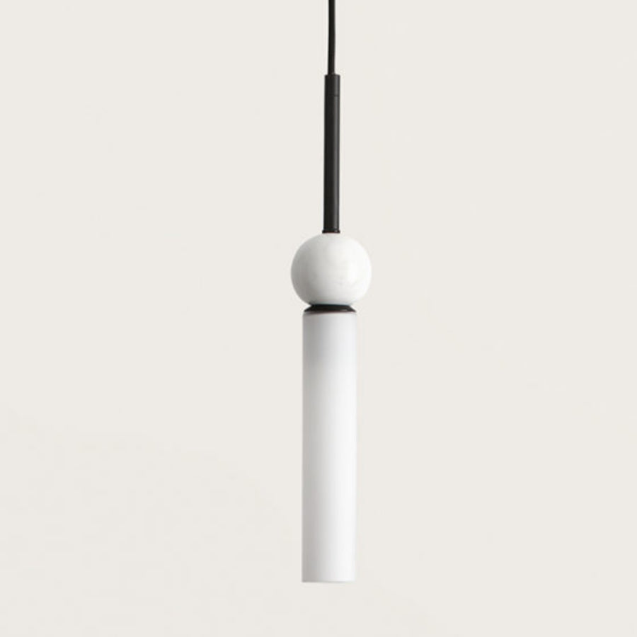 Close up of a black pendant lights in glass, marble and metal suspended from a ceiling from Aromas del Campo available at Spacio retail store in Mumbai & Kolkata. 
