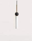 Close up of a black & gold pendant lights in glass, marble and metal suspended from a ceiling from Aromas del Campo available at Spacio retail store in Mumbai & Kolkata. 