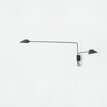 A modern wal light from Aromas Del Campo available at Spacio in India on a white background. 