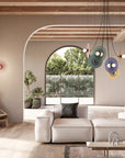 A modern living room with decorative wall light and chandelier