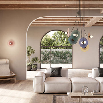 A modern living room with decorative wall light and chandelier