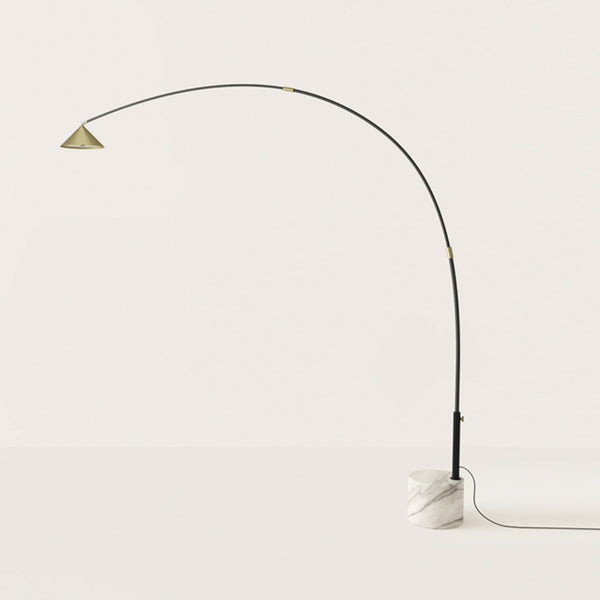 A modern design floor lamp in marble and metal on light cream colour background