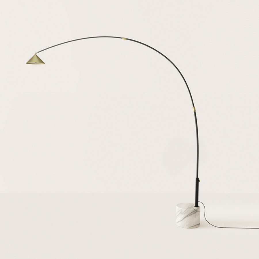A modern design floor lamp in marble and metal on light cream colour background