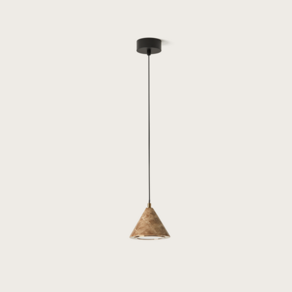 A pendant lamp in marble and brass detailing hanging from ceiling, from Aromas Del Campo available at Spacio retail stores in Mumbai & Kolkata. 