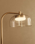 Close up of a modern design table lamp in brass and clear glass from Aromas Del Campo available at Spacio retail stores in Mumbai & Kolkata. 