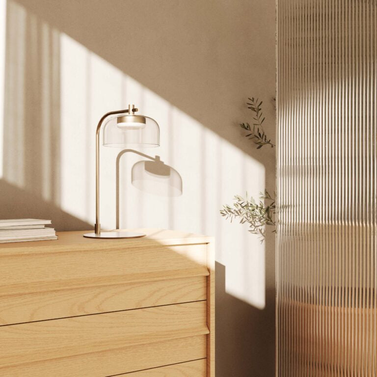 A table lamp on a wooden side board in a Scandinavian theme interior.