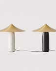 A pair table lamp in black and white marble and brass shades