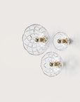 A set of 3 crystal wall lamp in three sizes on light beige colour background from Aromas Del Camp available at Spacio retail stores in India. 