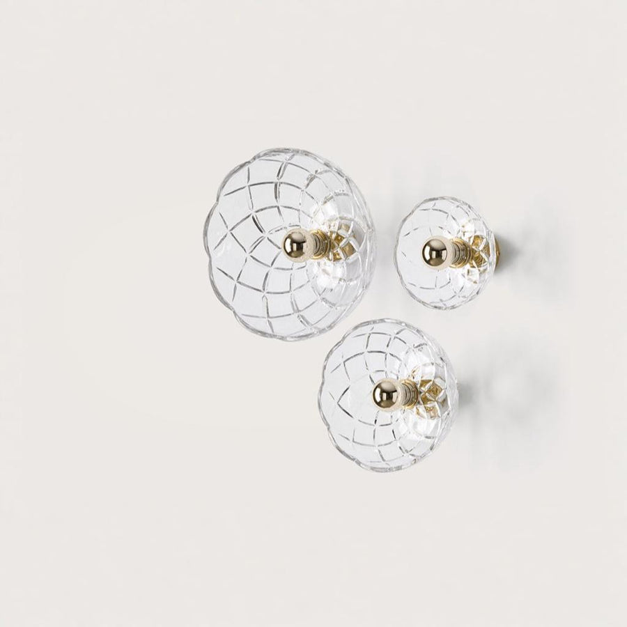 A set of 3 crystal wall lamp in three sizes on light beige colour background from Aromas Del Camp available at Spacio retail stores in India. 