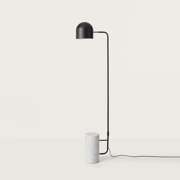 A modern design floor lamp in metal and marble on a light grey colour background from the Luca collection of lights from Aroma Del Campo, available at Spacio retail stores in India. 