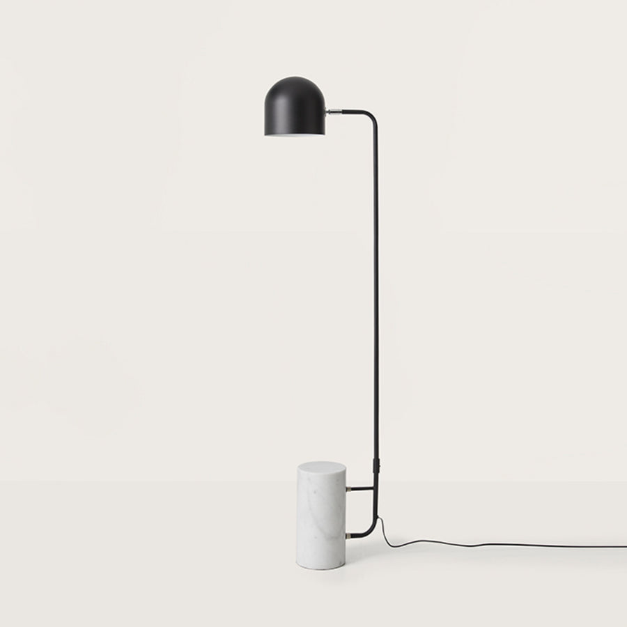 A modern design floor lamp in metal and marble on a light grey colour background from the Luca collection of lights from Aroma Del Campo, available at Spacio retail stores in India. 