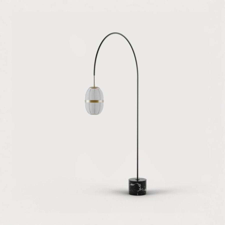 A tall floor lamp with marble base and brass detailing from Aromas Del Campo available at Spacio retail stores in Mumbai & Kolkata. 