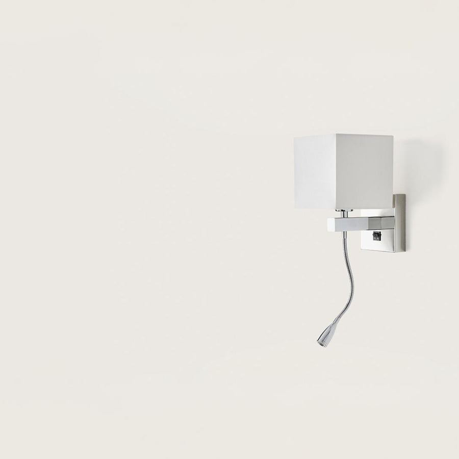 A wall light with white fabric shared on a light cream colour background