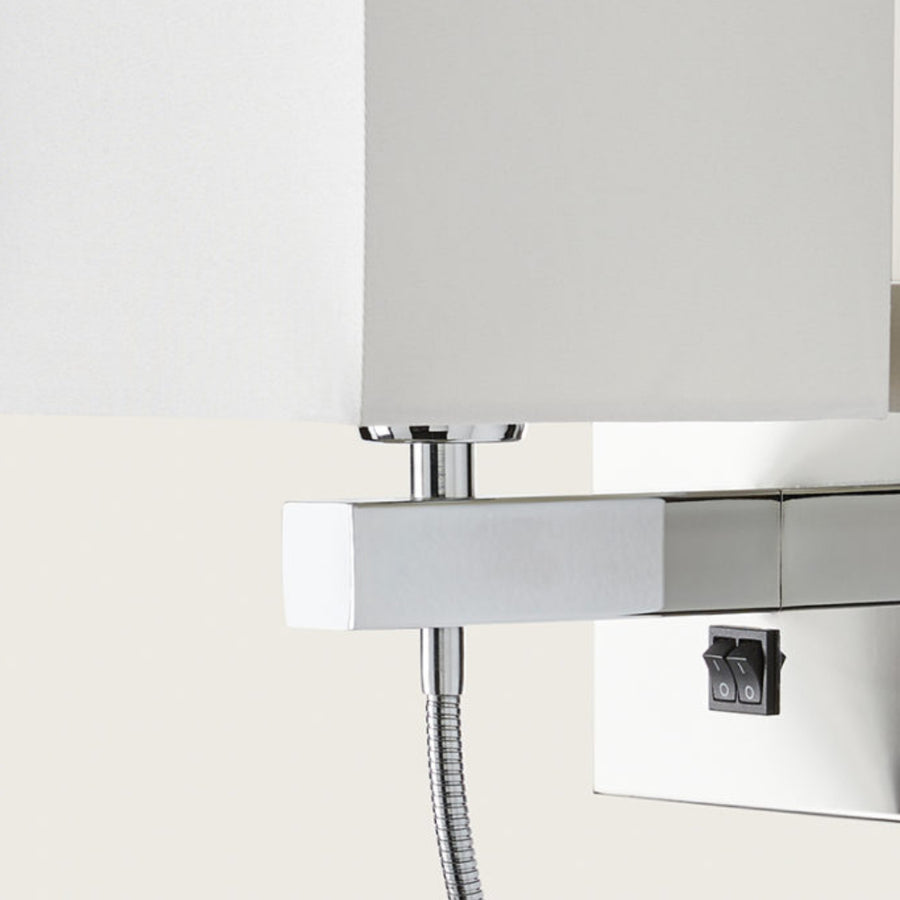 Close up of a wall light with white fabric shared on a light cream colour background