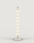 A modern design floor lamp on a light grey background from Aromas Del Campo, available at Spacio retail stores in Mumbai & Kolkata.