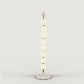 A modern design floor lamp on a light grey background from Aromas Del Campo, available at Spacio retail stores in Mumbai & Kolkata.