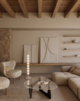 A Japandi theme living room with sofa, chair, coffee table, wall art, artefacts and modern design floor lamp. 