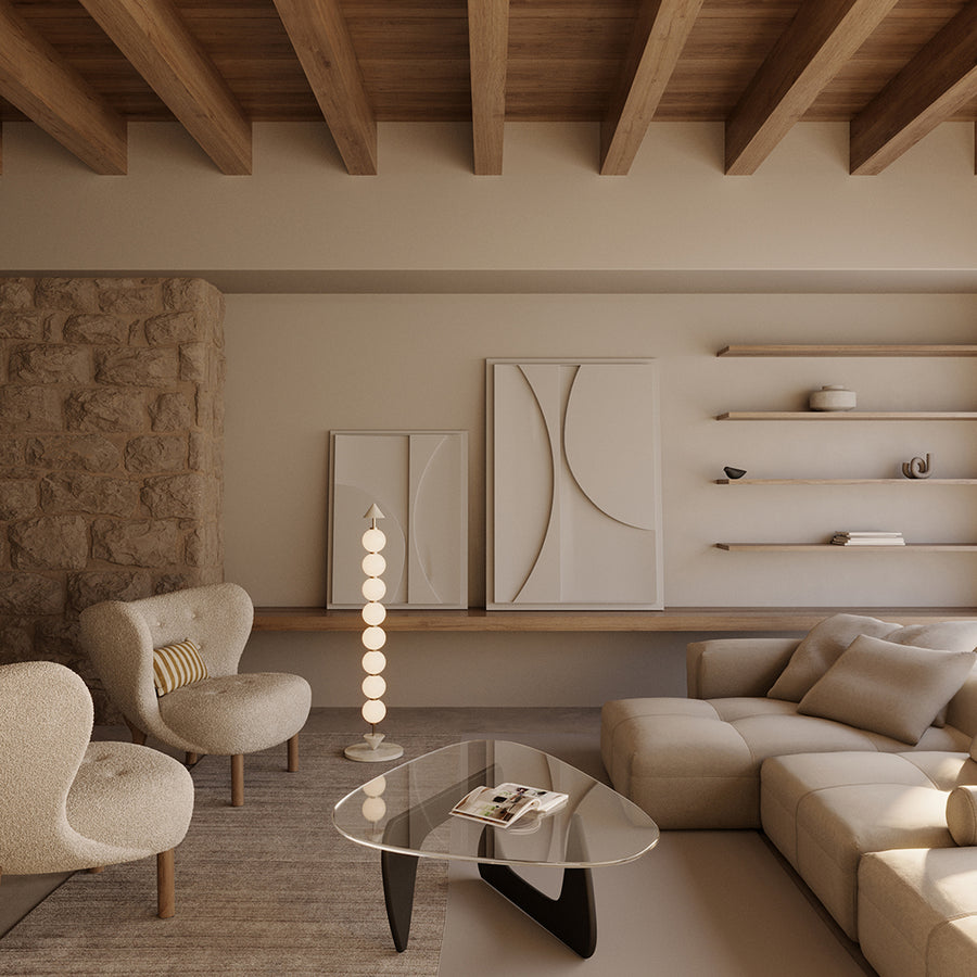 A Japandi theme living room with sofa, chair, coffee table, wall art, artefacts and modern design floor lamp. 