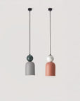 A pair of colourful pendant lights hanging from the ceiling in marble and ceramic from Aromas del campos available at Spacio retail stores in Mumbai & Kolkata. 