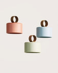 3 Multicolour rechargeable and portable pendant lamps from Aromas del camp on a light grey background available at Spacio retail stores in Mumbai & Kolkata. 
