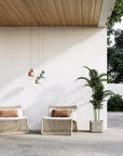 3 Multicolour rechargeable and portable pendant lamps hanging from a wooden ceiling in covered outdoor area. 