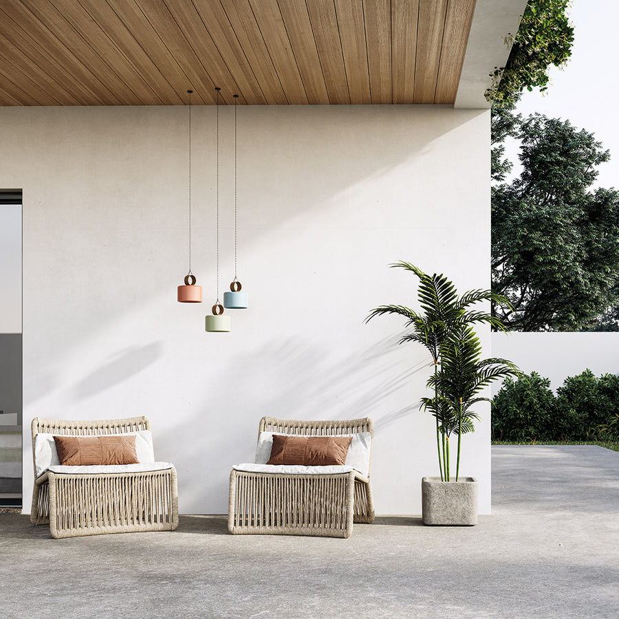 3 Multicolour rechargeable and portable pendant lamps hanging from a wooden ceiling in covered outdoor area. 