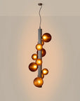 A lit up decorative suspension lamp hanging from the ceiling, by Aromas Del Campo available at Spacio retail stores in Mumbai & Kolkata. 