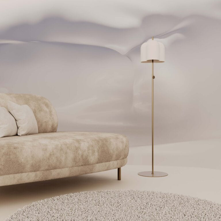 A sofa with an abstract wall paper and metal floor lamp. 