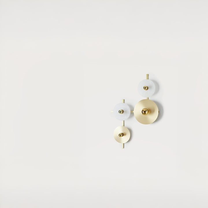Set of three circular wall lights in gold and white on a light gray background from Aroma Del Campo available at Spacio retail stores in Mumbai & Kolkata