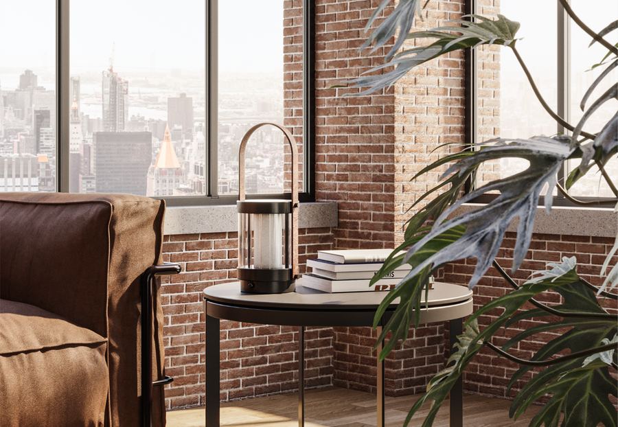 Modern interior with a brown armchair, round table, and cityscape view.