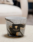 Close-up of Baobab Stones Marble Candle placed on a marble-patterned table, perfect for modern Indian interiors