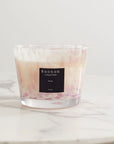 Baobab White Pearls Candle Max 10 placed on marble tabletop, featuring hand-blown glass and signature scent of white musk and freesia at Spacio India.