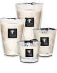 Collection of Baobab White Pearls Candles in multiple sizes, featuring glass jars with floral scent, available at Spacio India.