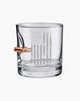 Clear whiskey glass with American flag engraving and bullet on a white background from the American brand Benshot available at Spacio retail stores in Mumbai & Kolkata. 