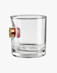 Clear glass with a shotgun shell bullet on a white background from the American brand Benshot available at Spacio retail stores in Mumbai & Kolkata. 