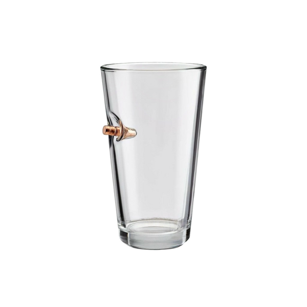 Clear beer pint glass with a bullet on a white background from the American brand Benshot available at Spacio retail stores in Mumbai & Kolkata. 