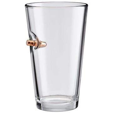 Clear beer pint glass with a bullet on a white background from the American brand Benshot available at Spacio retail stores in Mumbai & Kolkata. 