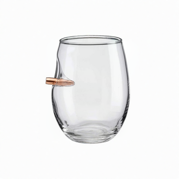 Clear wine glass with a bullet-shaped object inside on a white background from American brand Benshot available at Spacio retail stores in Mumbai & Kolkata. 